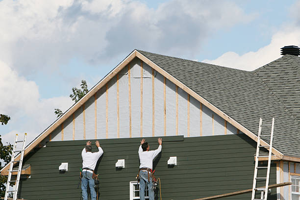 Professional Storm Damage Siding Repair technician working in Belle Vernon, PA